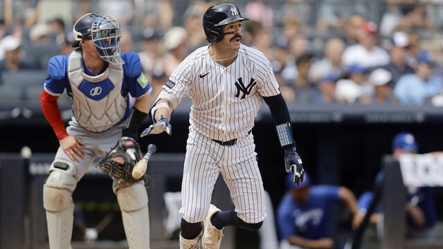 NEW YORK, NEW YORK - SEPTEMBER 06: Austin Wells #28 of the New York Yankees follows through on his second inning run scoring sacrifice fly against the Toronto Blue Jays at Yankee Stadium on September 06, 2025 in New York City.