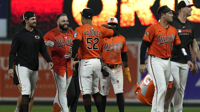 BALTIMORE, MARYLAND - SEPTEMBER 06: Emmanuel Rivera #26 of the Baltimore Orioles celebrates with Luis Vázquez #52 after hitting a single in the ninth inning to walk off the Los Angeles Dodgers at Oriole Park at Camden Yards on September 06, 2025 in Baltimore, Maryland.