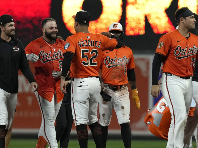 BALTIMORE, MARYLAND - SEPTEMBER 06: Emmanuel Rivera #26 of the Baltimore Orioles celebrates with Luis Vázquez #52 after hitting a single in the ninth inning to walk off the Los Angeles Dodgers at Oriole Park at Camden Yards on September 06, 2025 in Baltimore, Maryland.