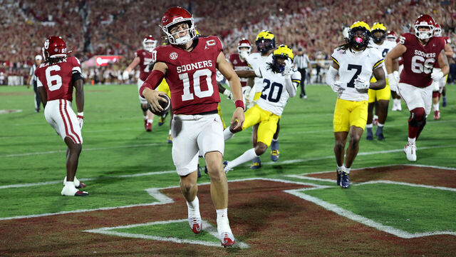 NORMAN, OKLAHOMA - SEPTEMBER 06: John Mateer #10 of the Oklahoma Sooners rushes for a touchdown against the Michigan Wolverines during the second half of a game at Gaylord Family Oklahoma Memorial Stadium on September 06, 2025 in Norman, Oklahoma.