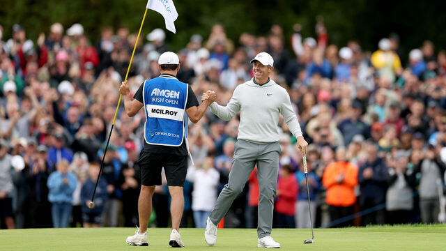 STRAFFAN, IRELAND - SEPTEMBER 07: Rory McIlroy of Northern Ireland celebrates with his caddie Harry Diamond after an eagle on the 18th green on day four of the Amgen Irish Open 2025 at The K Club on September 07, 2025 in Straffan, Ireland.