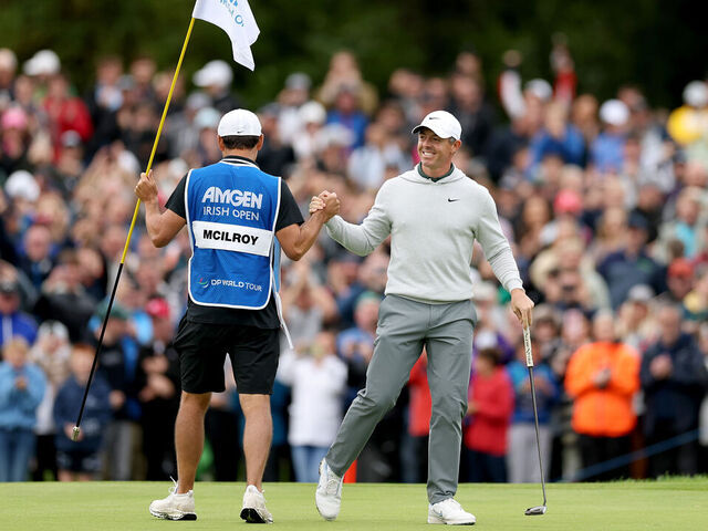 STRAFFAN, IRELAND - SEPTEMBER 07: Rory McIlroy of Northern Ireland celebrates with his caddie Harry Diamond after an eagle on the 18th green on day four of the Amgen Irish Open 2025 at The K Club on September 07, 2025 in Straffan, Ireland.