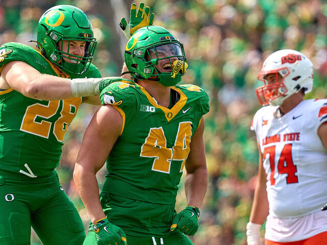 EUGENE, OREGON - SEPTEMBER 6: Teitum Tuioti #44 celebrates with Bryce Boettcher #28 of the Oregon Ducks fter a play during the first half of the game against the Oklahoma State Cowboys at Autzen Stadium on September 6, 2025 in Eugene, Oregon.