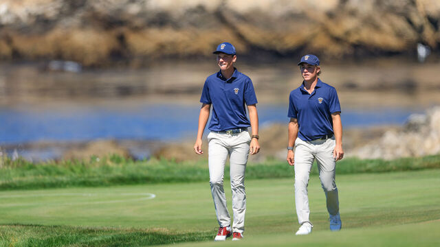 PEBBLE BEACH, CALIFORNIA - SEPTEMBER 07: Mason Howell of the United States and his partner Jacob Modleski walk to the green on the 17th hole in their match against Stuart Grehan and Eliot Baker of the GB&I team during the morning foursomes matches in the 2025 Walker Cup Match at The Cypress Point Club on September 07, 2025 in Pebble Beach, California.