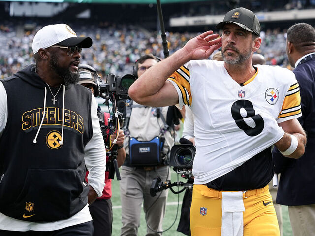 EAST RUTHERFORD, NEW JERSEY - SEPTEMBER 07: Aaron Rodgers #8 and head coach Mike Tomlin of the Pittsburgh Steelers react after beating the New York Jets 34-32 during the game at MetLife Stadium on September 07, 2025 in East Rutherford, New Jersey.