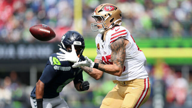 SEATTLE, WASHINGTON - SEPTEMBER 07: George Kittle #85 of the San Francisco 49ers catches a pass against Coby Bryant #8 of the Seattle Seahawks during the first quarter during the game at Lumen Field on September 07, 2025 in Seattle, Washington.