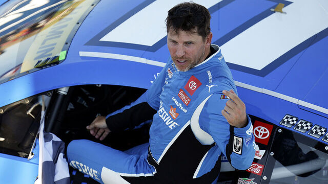 MADISON, ILLINOIS - SEPTEMBER 07: Denny Hamlin, driver of the #11 Progressive Toyota, exits his car after winning the NASCAR Cup Series Enjoy Illinois 300 at WWT Raceway on September 07, 2025 in Madison, Illinois.