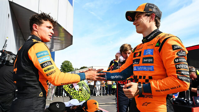 MONZA, ITALY - SEPTEMBER 07: Second placed Lando Norris of Great Britain and McLaren and Third placed Oscar Piastri of Australia and McLaren congralate each other in parc ferme during the F1 Grand Prix of Italy at Autodromo Nazionale Monza on September 07, 2025 in Monza, Italy.