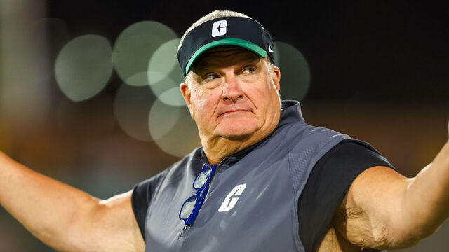 CHARLOTTE, NORTH CAROLINA - OCTOBER 31: Head Coach Biff Poggi of the Charlotte 49ers reacts to the crowd during the first half of a football game against the Tulane Green Wave at Jerry Richardson Stadium on October 31, 2024 in Charlotte, North Carolina.