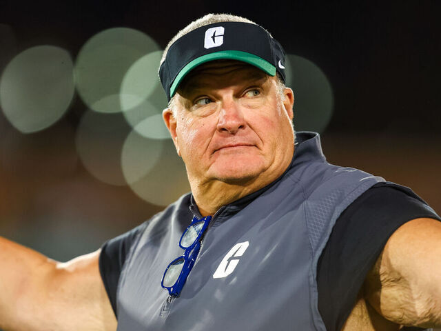 CHARLOTTE, NORTH CAROLINA - OCTOBER 31: Head Coach Biff Poggi of the Charlotte 49ers reacts to the crowd during the first half of a football game against the Tulane Green Wave at Jerry Richardson Stadium on October 31, 2024 in Charlotte, North Carolina.