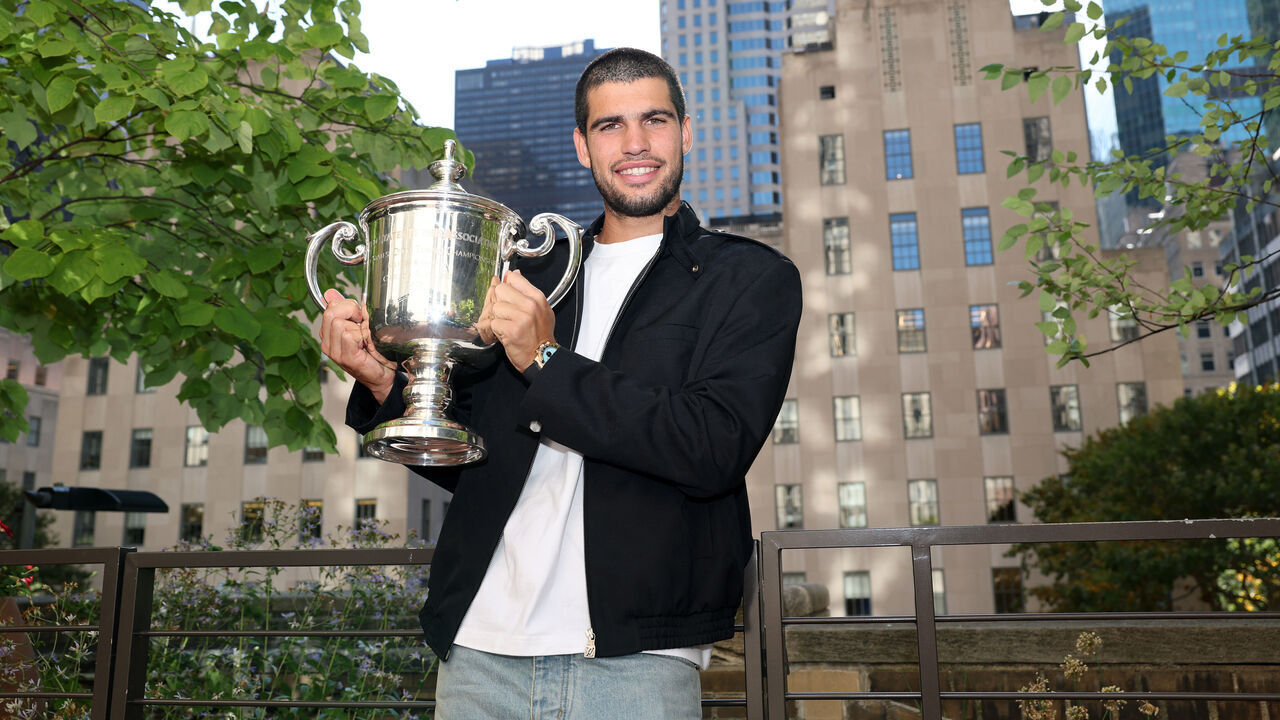 NEW YORK, NEW YORK - SEPTEMBER 08: US Open 2025 Champion Carlos Alcaraz of Spain poses for a photo overlooking the Rockefeller Plaza with the Men's Singles trophy following his victory over Jannik Sinner of Italy in the Men's Singles Final on September 08, 2025 in New York City.