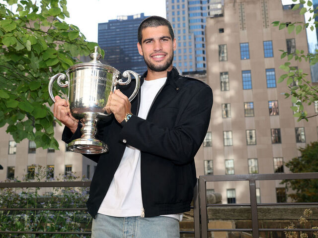 NEW YORK, NEW YORK - SEPTEMBER 08: US Open 2025 Champion Carlos Alcaraz of Spain poses for a photo overlooking the Rockefeller Plaza with the Men's Singles trophy following his victory over Jannik Sinner of Italy in the Men's Singles Final on September 08, 2025 in New York City.
