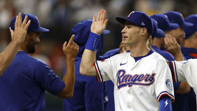 ARLINGTON, TX - SEPTEMBER 08: Michael Helman #24 of the Texas Rangers celebrates with teammates following the team's win over the Milwaukee Brewers at Globe Life Field on September 8, 2025 in Arlington, Texas.