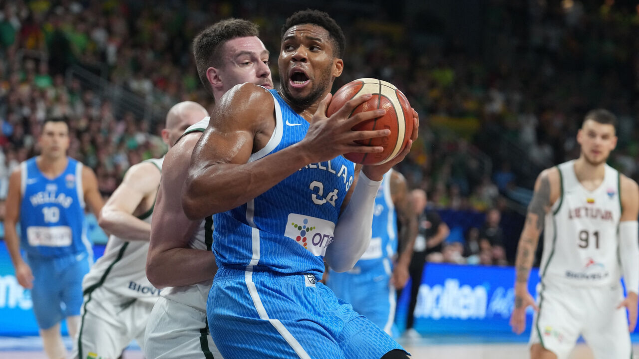 Lithuania's center #01 Marek Blazevic (L) vies with Greece's small forward #34 Giannis Antetokounmpo during the FIBA EuroBasket 2025 basketball quarter final match between Lithuania and Greece at the Arena Riga in Riga, Latvia, on September 9, 2025.