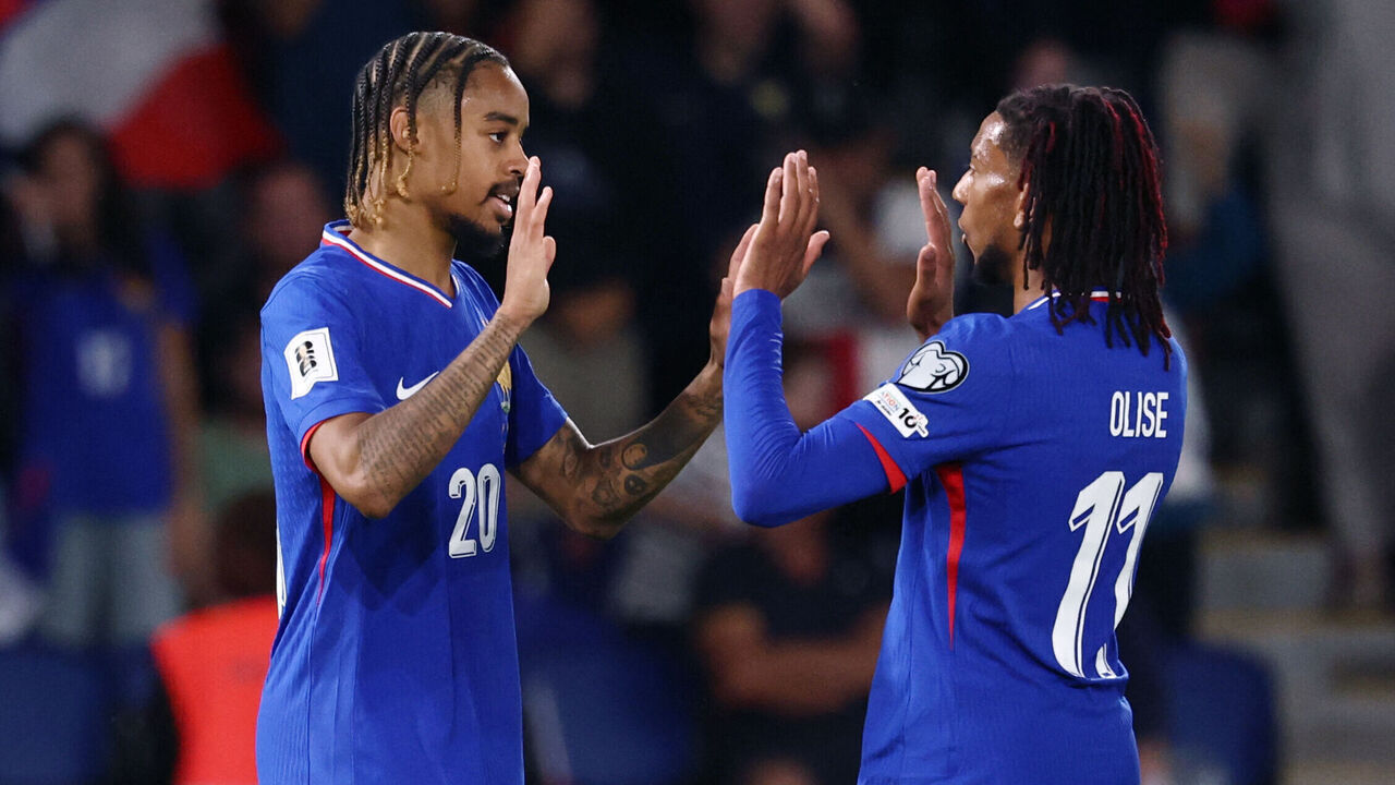 France's forward #20 Bradley Barcola (L) fights for the ball with France's forward #11 Michael Olise after scoring his team's second goal during the FIFA World Cup 2026 Group D European qualification football match between France and Iceland at the Parc des Princes stadium in Paris, on September 9, 2025.