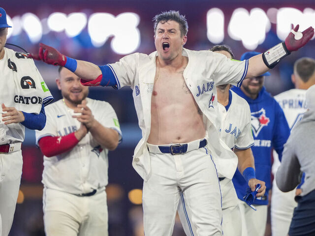 TORONTO, CANADA - SEPTEMBER 9: Tyler Heineman #55 of the Toronto Blue Jays celebrates after hitting a walk off single against the Houston Astros during the tenth inning in their MLB game at Rogers Centre on September 9, 2025 in Toronto, Canada.
