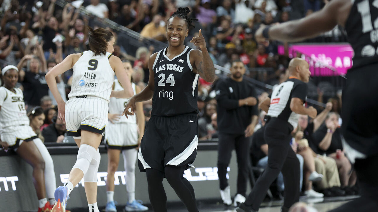 LAS VEGAS, NEVADA - SEPTEMBER 09: Jewell Loyd #24 of the Las Vegas Aces gestures towards teammate Chelsea Gray #12 after a three point basket during the third quarter of a game against the Chicago Sky at T-Mobile Arena on September 09, 2025 in Las Vegas, Nevada.