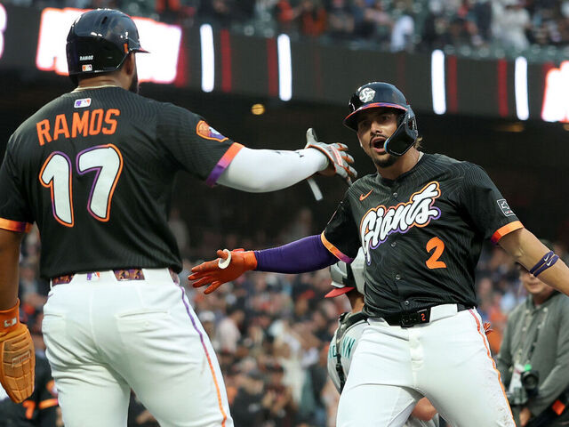 SAN FRANCISCO, CALIFORNIA - SEPTEMBER 09: Willy Adames #2 of the San Francisco Giants is congratulated by Heliot Ramos #17 after he hit a three-run home run off of Zac Gallen #23 of the Arizona Diamondbacks in the first inning at Oracle Park on September 09, 2025 in San Francisco, California.