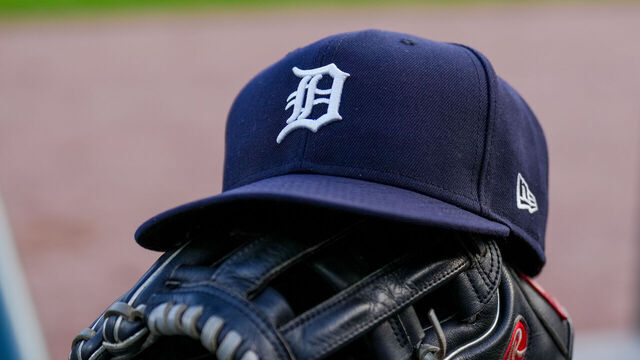 DETROIT, MICHIGAN - JUNE 25: A detail of a New Era Detroit Tigers baseball hat and Rawlings baseball glove during the game against the Athletics at Comerica Park on June 25, 2025 in Detroit, Michigan.