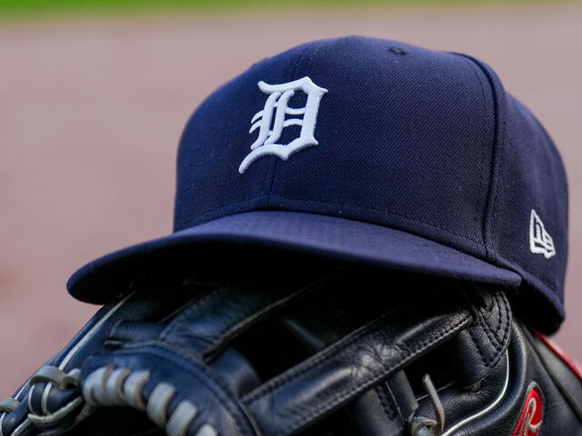 DETROIT, MICHIGAN - JUNE 25: A detail of a New Era Detroit Tigers baseball hat and Rawlings baseball glove during the game against the Athletics at Comerica Park on June 25, 2025 in Detroit, Michigan.