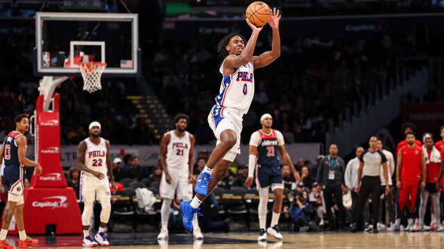 WASHINGTON, DC - DECEMBER 06: Tyrese Maxey #0 of the Philadelphia 76ers shoots and scores on a half-court, three pointer as time expires in the first half against the Washington Wizards at Capital One Arena on December 06, 2023 in Washington, DC.