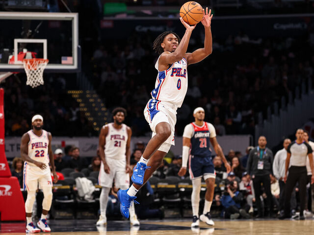 WASHINGTON, DC - DECEMBER 06: Tyrese Maxey #0 of the Philadelphia 76ers shoots and scores on a half-court, three pointer as time expires in the first half against the Washington Wizards at Capital One Arena on December 06, 2023 in Washington, DC.