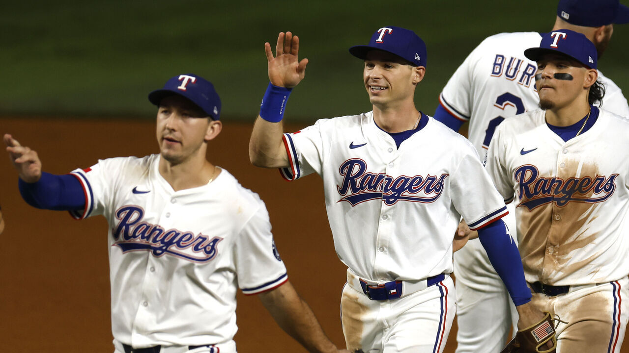 ARLINGTON, TX - SEPTEMBER 9: Michael Helman #24 of the Texas Rangers celebrates with teammates following the win over the Milwaukee Brewers at Globe Life Field on September 9, 2025 in Arlington, Texas.