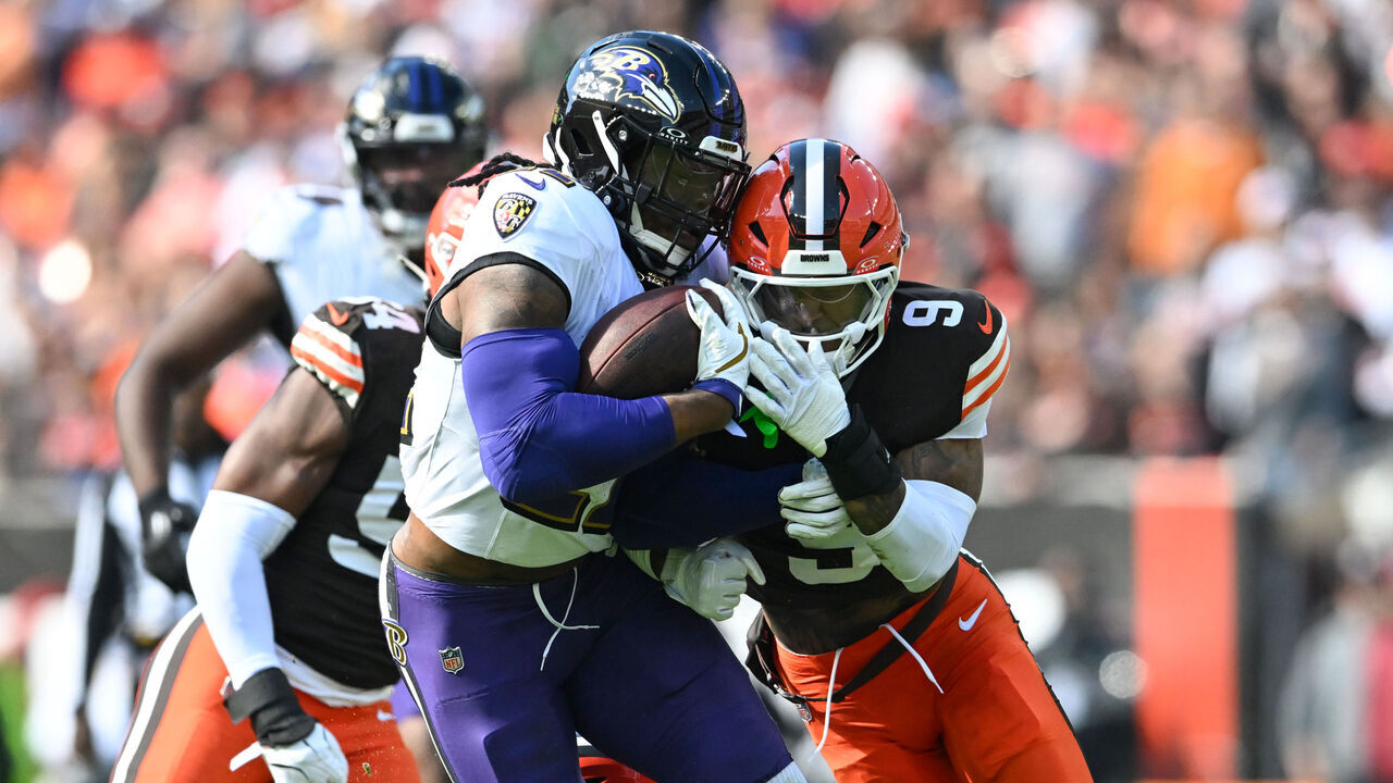 CLEVELAND, OHIO - OCTOBER 27: Grant Delpit #9 of the Cleveland Browns tackles Derrick Henry #22 of the Baltimore Ravens during the first quarter at Huntington Bank Field on October 27, 2024 in Cleveland, Ohio.