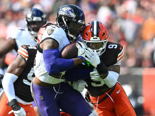 CLEVELAND, OHIO - OCTOBER 27: Grant Delpit #9 of the Cleveland Browns tackles Derrick Henry #22 of the Baltimore Ravens during the first quarter at Huntington Bank Field on October 27, 2024 in Cleveland, Ohio.
