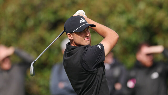 VIRGINIA WATER, ENGLAND - SEPTEMBER 11: Ludvig Aberg of Sweden plays his second shot on the 18th hole on day one of the BMW PGA Championship 2025 at Wentworth Golf Club on September 11, 2025 in Virginia Water, England.