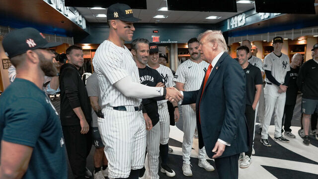NEW YORK, NY - SEPTEMBER 11: U.S. President Donald Trump shakes hands with Aaron Judge of the New York Yankees in the locker room before a game against the Detroit Tigers at Yankee Stadium on September 11, 2025 in New York City.