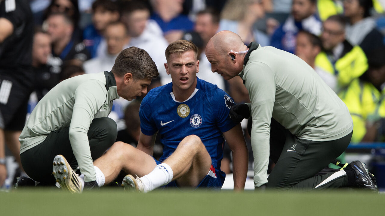 LONDON, ENGLAND - AUGUST 30: Liam Delap of Chelsea receives medical attention after picking up an injury during the Premier League match between Chelsea and Fulham at Stamford Bridge on August 30, 2025 in London, England.
