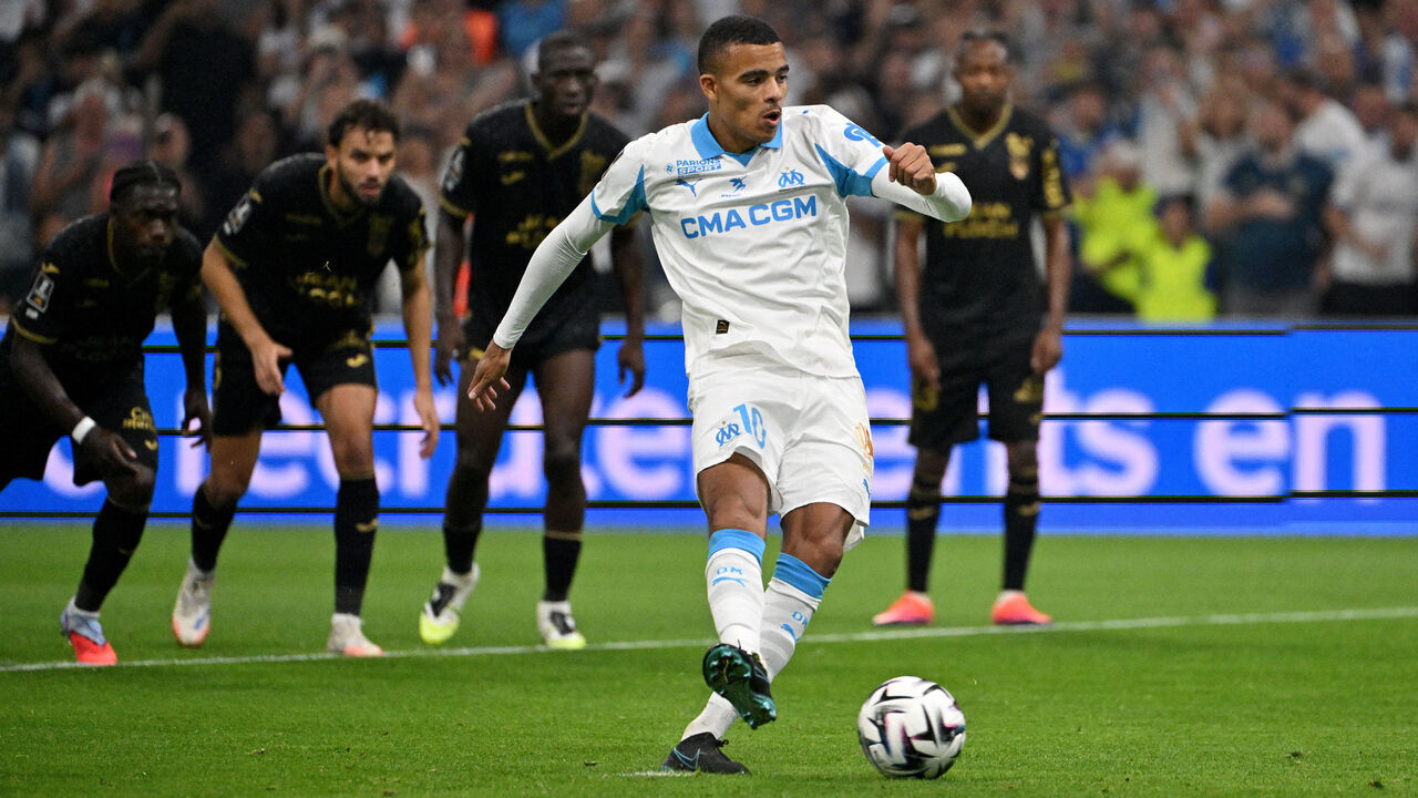 Marseille's English forward #10 Mason Greenwood shoots from the penalty spot to score his team's first goal during the French L1 football match between Olympique de Marseille (OM) and FC Lorient at the Stade Velodrome in Marseille, southern France on September 12, 2025.