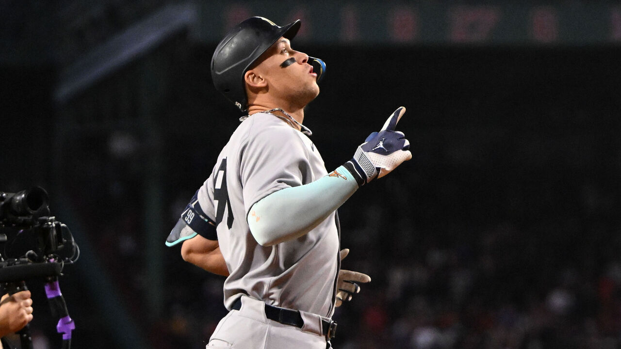 BOSTON, MASSACHUSETTS - SEPTEMBER 12: Aaron Judge #99 of the New York Yankees reacts after hitting a solo home run against the Boston Red Sox during the first inning at Fenway Park on September 12, 2025 in Boston, Massachusetts.