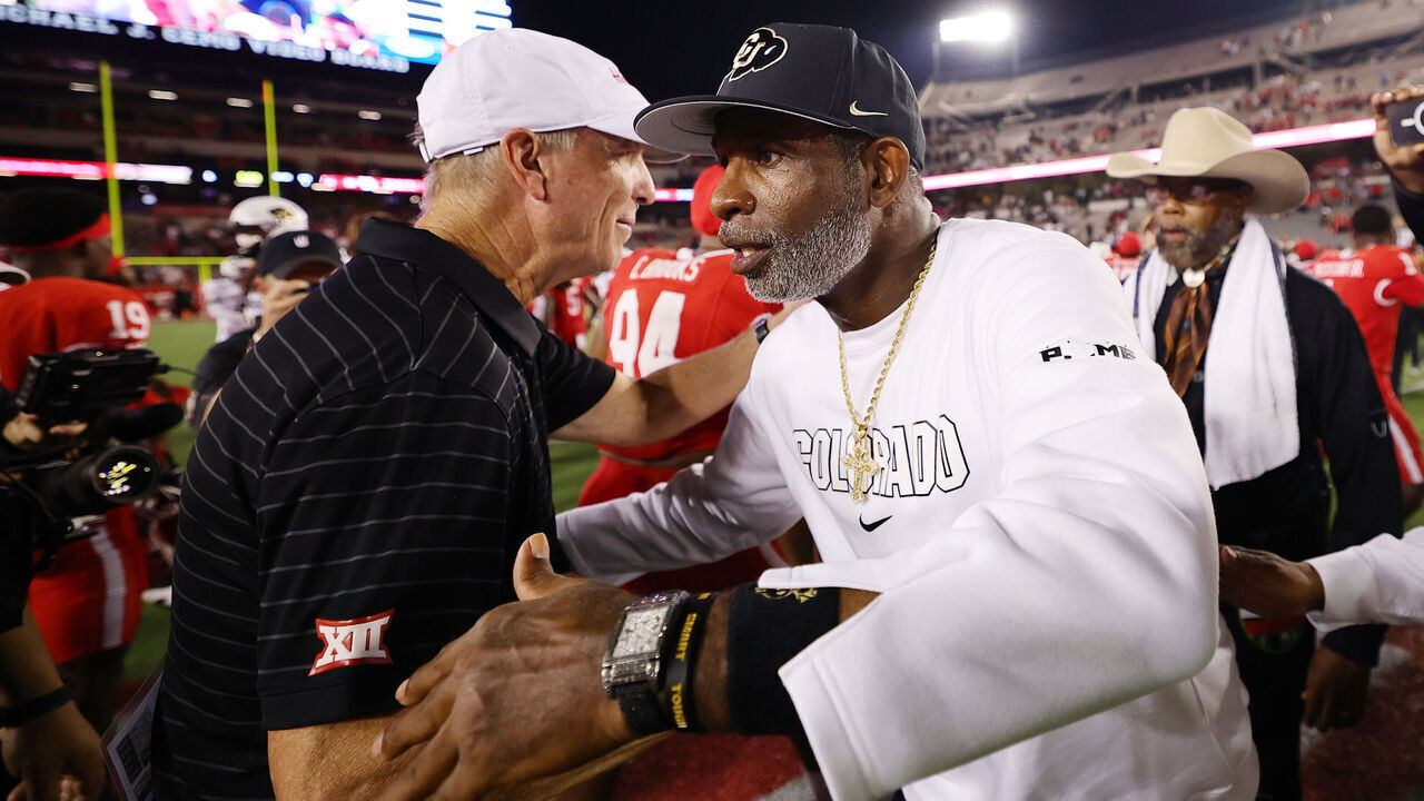 HOUSTON, TEXAS - SEPTEMBER 12: Head coach Willie Fritz of the Houston Cougars and head coach Deion Sanders of the Colorado Buffaloes speak after the game at TDECU Stadium on September 12, 2025 in Houston, Texas.