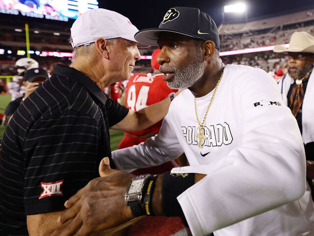 HOUSTON, TEXAS - SEPTEMBER 12: Head coach Willie Fritz of the Houston Cougars and head coach Deion Sanders of the Colorado Buffaloes speak after the game at TDECU Stadium on September 12, 2025 in Houston, Texas.