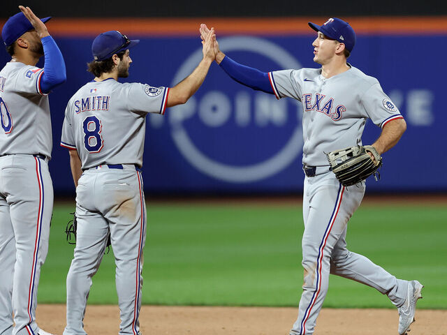 NEW YORK, NEW YORK - SEPTEMBER 13: Ezequiel Duran #20, Josh Smith #8 and Wyatt Langford #36 of the Texas Rangers celebrate the win over the New York Mets at Citi Field on September 13, 2025 in the Flushing neighborhood of the Queens borough of New York City. The Texas Rangers defeated the New York Mets 3-2.