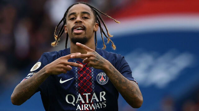 Paris Saint-Germain's French forward #29 Bradley Barcola celebrates after scoring his team's second goal during the French L1 football match between Paris Saint-Germain (PSG) and RC Lens at the Parc des Princes stadium in Paris, on September 14, 2025.