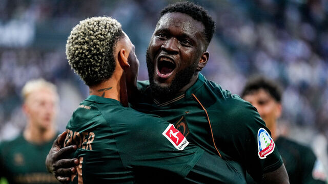 MOENCHENGLADBACH, GERMANY - SEPTEMBER 14: Justin Njinmah of SV Werder Bremen and Victor Boniface of SV Werder Bremen celebrate their team's fourth goal during the Bundesliga match between Borussia Monchengladbach and SV Werder Bremen at Borussia-Park on September 14, 2025 in Moenchengladbach, Germany.