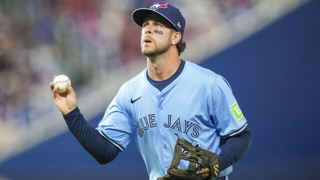MIAMI, FLORIDA - AUGUST 23: Ernie Clement #22 of the Toronto Blue Jays looks for a fan to throw the ball to during the sixth inning against the Miami Marlins at loanDepot park on August 23, 2025 in Miami, Florida.
