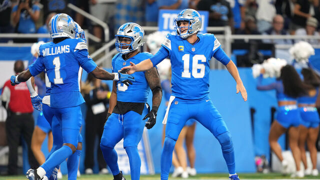 DETROIT, MICHIGAN - SEPTEMBER 14: Jared Goff #16 of the Detroit Lions celebrates after Jameson Williams #1 scores a touchdown in the second half of the game against the Chicago Bears at Ford Field on September 14, 2025 in Detroit, Michigan.