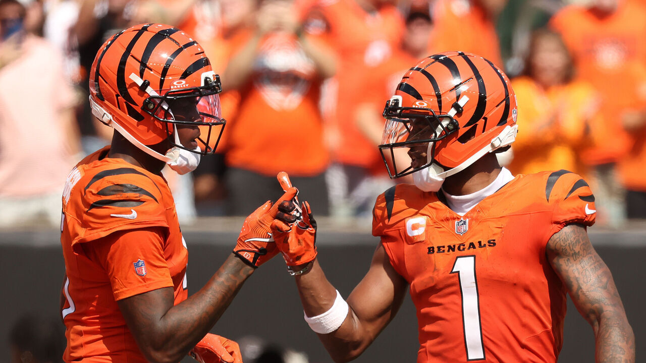 CINCINNATI, OHIO - SEPTEMBER 14: Tee Higgins #5 of the Cincinnati Bengals celebrates with Ja'Marr Chase #1 after scoring a touchdown against the Jacksonville Jaguars in the second half of the game at Paycor Stadium on September 14, 2025 in Cincinnati, Ohio.