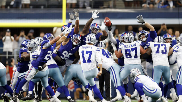 ARLINGTON, TEXAS - SEPTEMBER 14: Brandon Aubrey #17 of the Dallas Cowboys kicks a field goal in overtime in the game against the New York Giants at AT&T Stadium on September 14, 2025 in Arlington, Texas.