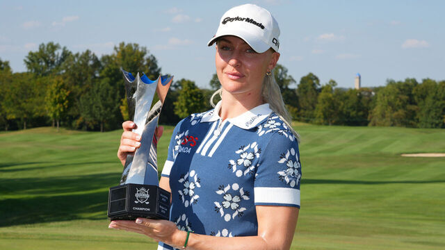 CINCINNATI, OHIO - SEPTEMBER 14: Charley Hull of England poses with the trophy after winning the Kroger Queen City Championship presented by P&G 2025 at TPC River's Bend on September 14, 2025 in Cincinnati, Ohio.