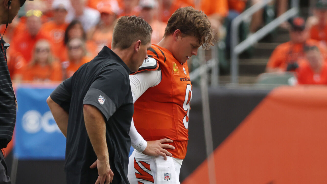 CINCINNATI, OHIO - SEPTEMBER 14: Joe Burrow #9 of the Cincinnati Bengals is helped off the field following an injury in the second quarter of the game against the Jacksonville Jaguars at Paycor Stadium on September 14, 2025 in Cincinnati, Ohio.