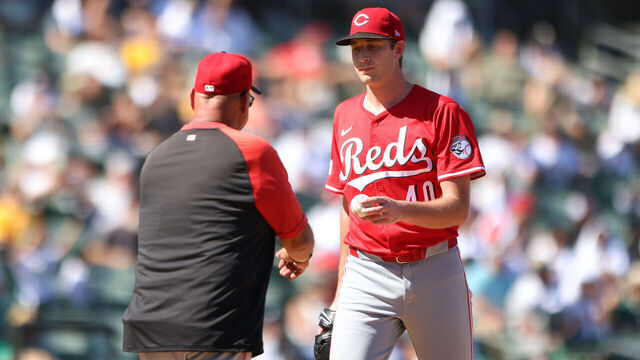 SACRAMENTO, CALIFORNIA - SEPTEMBER 14: Nick Lodolo #40 of the Cincinnati Reds hands manager Terry Francona #77 the ball as he gets taken out during the bottom of the sixth inning against the Athletics at Sutter Health Park on September 14, 2025 in Sacramento, California.