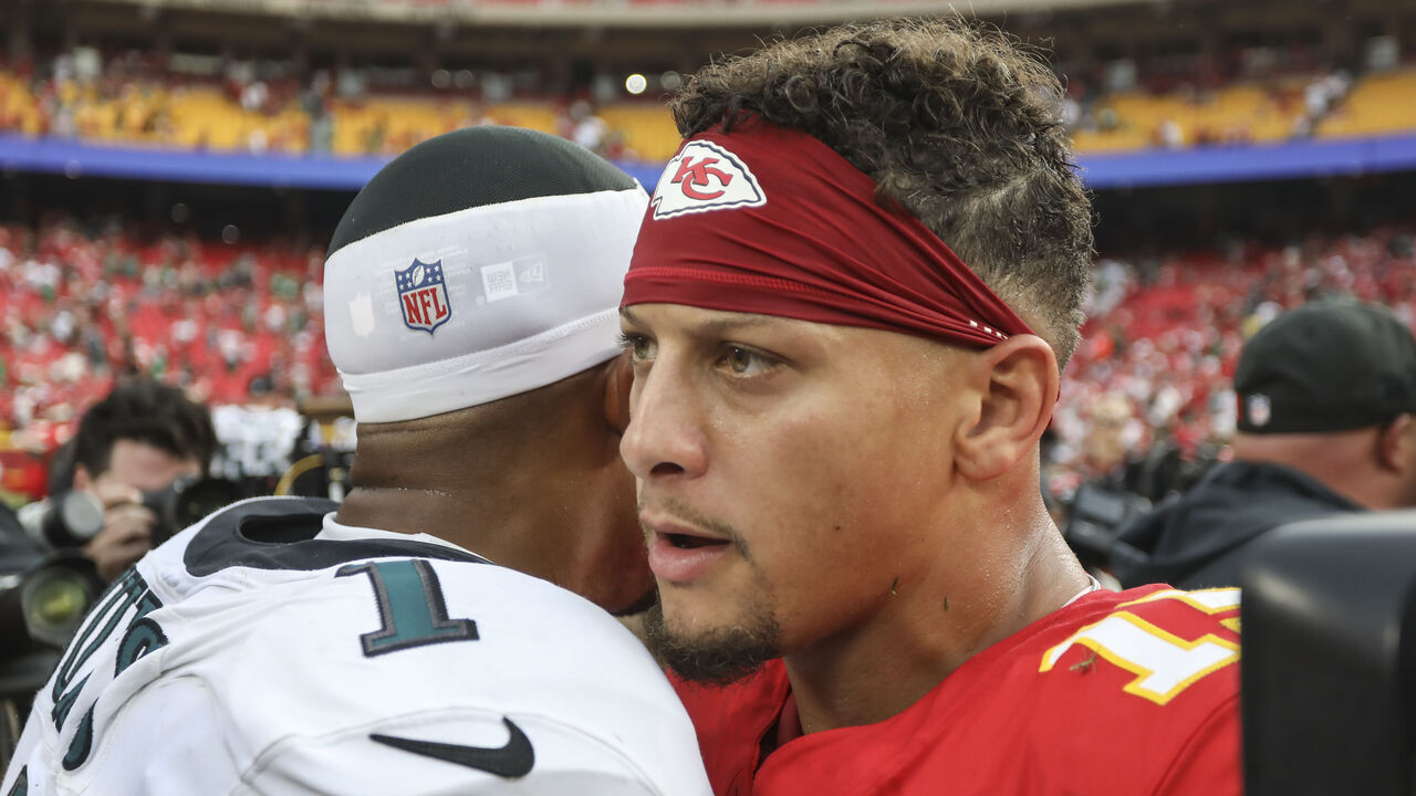 KANSAS CITY, MO - SEPTEMBER 14: Kansas City Chiefs quarterback Patrick Mahomes (15) and Philadelphia Eagles quarterback Jalen Hurts (1) embrace on the field after an NFL game between the Philadelphia Eagles and Kansas City Chiefs on September 14, 2025 at GEHA Field at Arrowhead Stadium in Kansas City, MO.
