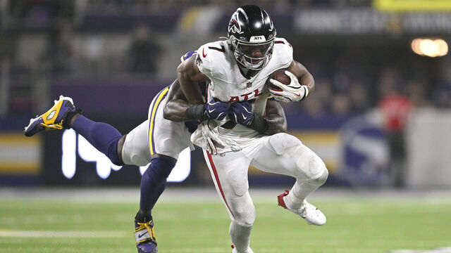 MINNEAPOLIS, MINNESOTA - SEPTEMBER 14: Bijan Robinson #7 of the Atlanta Falcons is tackled by Dallas Turner #15 of the Minnesota Vikings during the fourth quarter in the game at U.S. Bank Stadium on September 14, 2025 in Minneapolis, Minnesota.