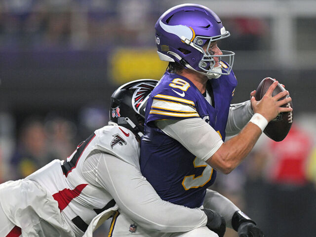MINNEAPOLIS, MN - SEPTEMBER 14: Atlanta Falcons defensive lineman Brandon Dorlus (54) sacks Minnesota Vikings quarterback J.J. McCarthy (9) during the second quarter of a NFL game between the Minnesota Vikings and Atlanta Falcons on September 14, 2025, at U.S. Bank Stadium in Minneapolis, MN.