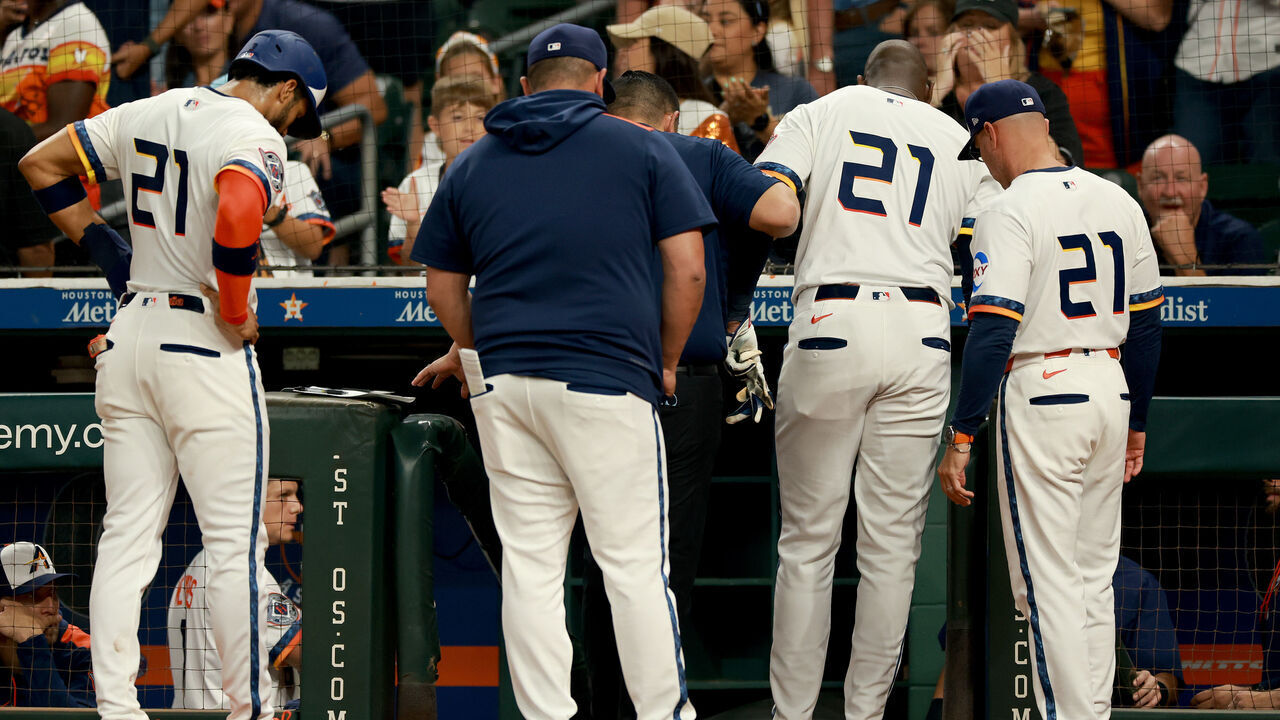 HOUSTON, TEXAS - SEPTEMBER 15: Yordan Alvarez #44 of the Houston Astros is helped off the field turning his ankle at home plate in the first inning against the Texas Rangers at Daikin Park on September 15, 2025 in Houston, Texas.